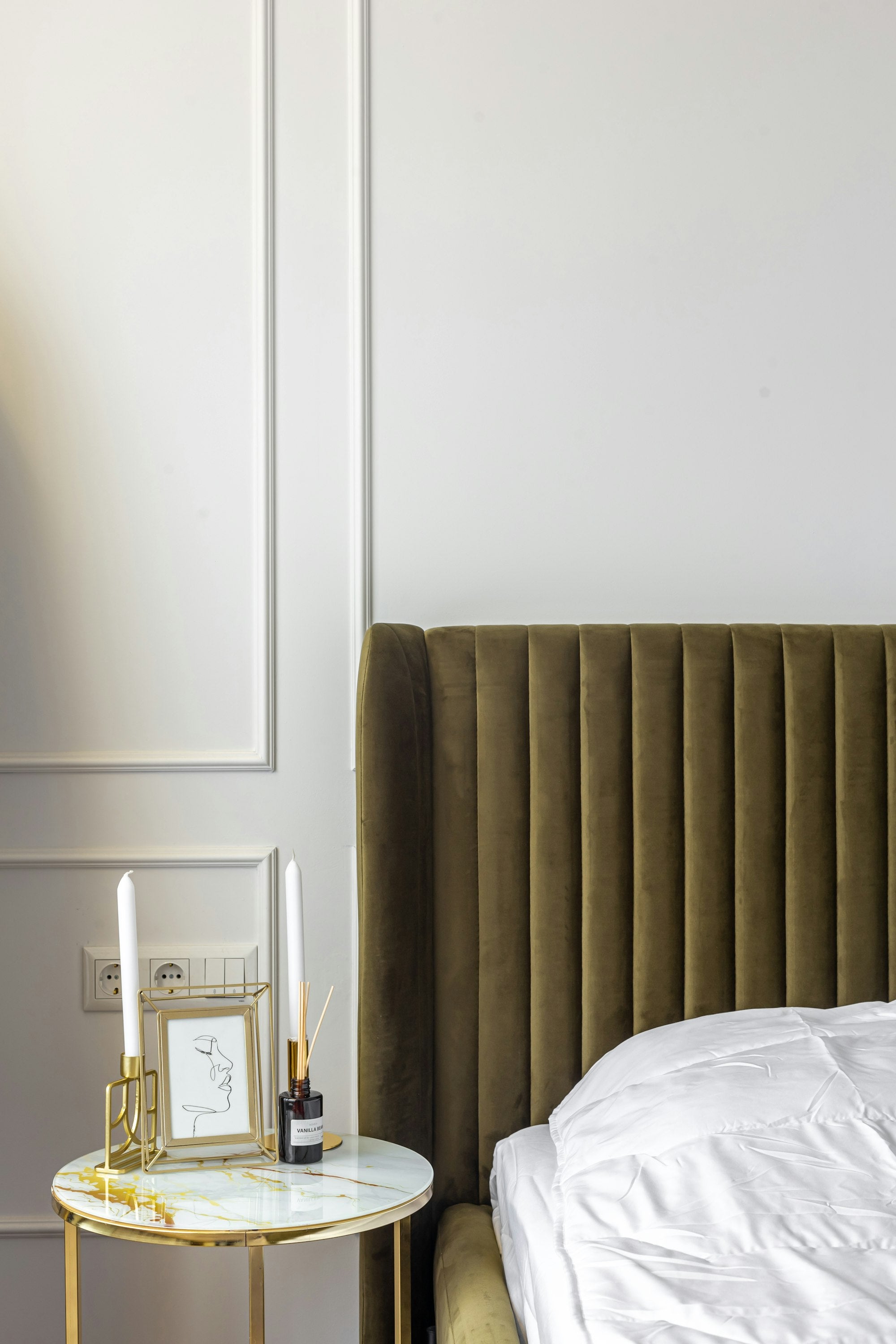 Bedroom nightstand styled with a lamp